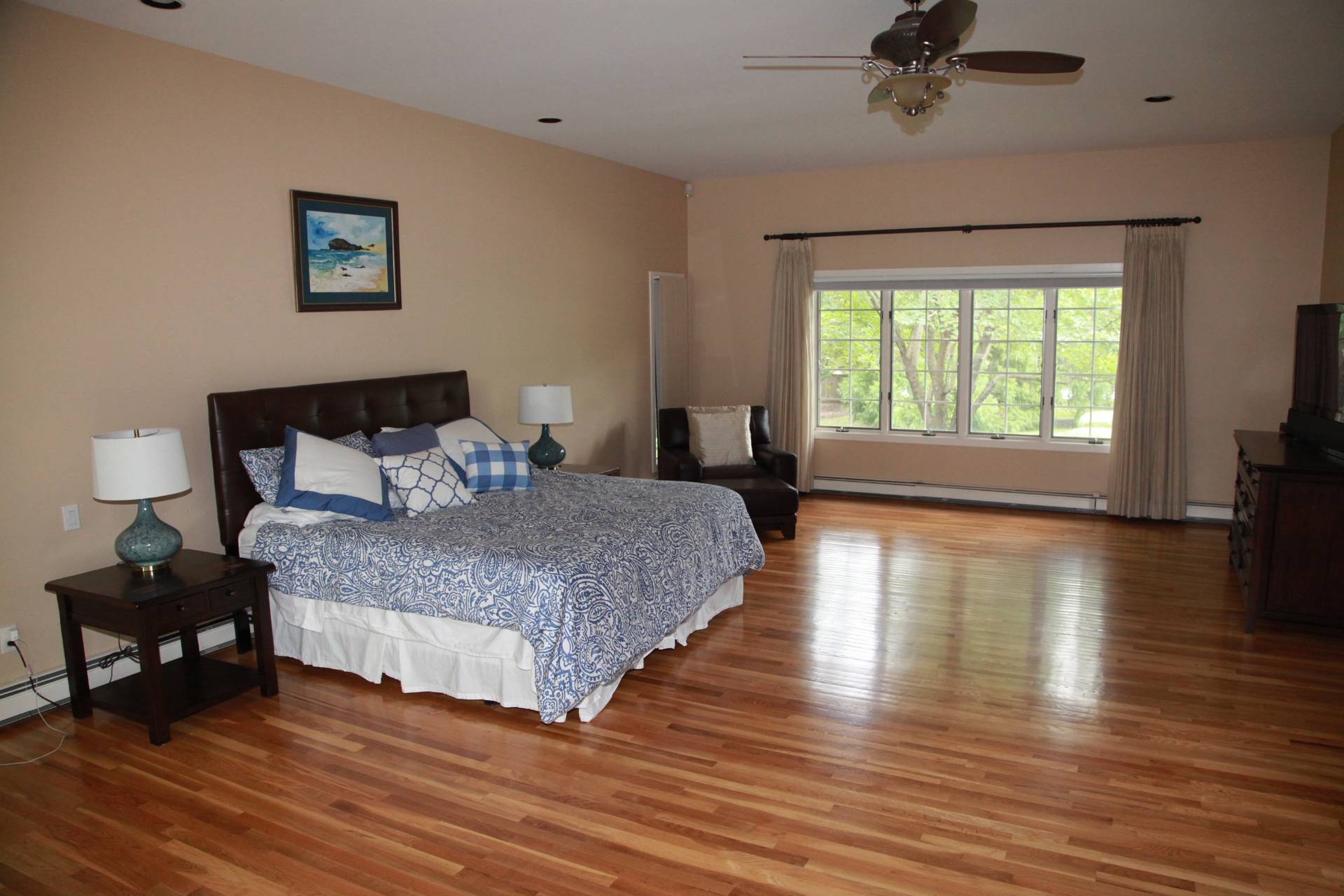 3 Stone Lane Quogue, NY 11959 - Photo 10 of 35 a bedroom with a bed and wooden floor