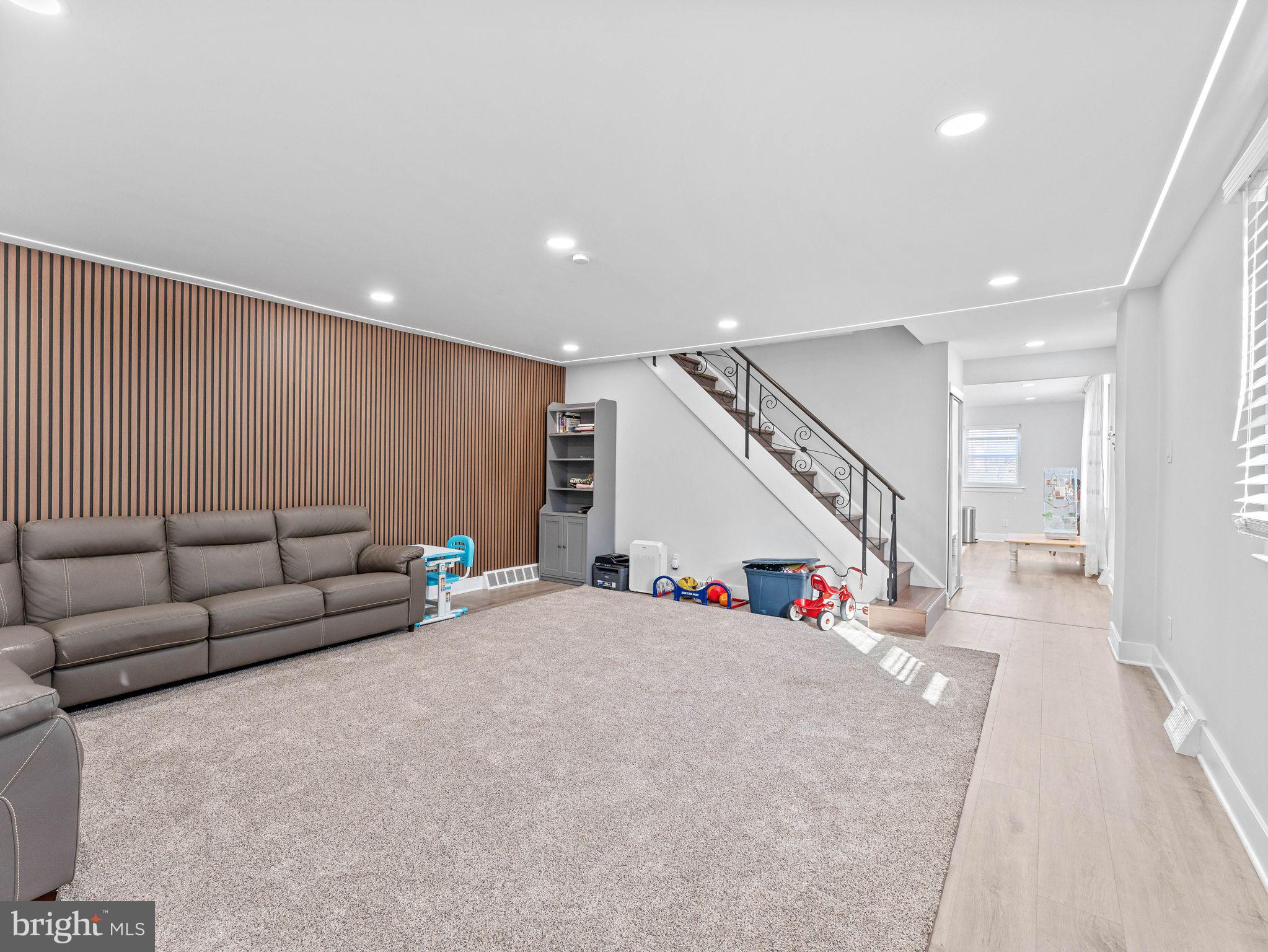 1152 Morefield Road Philadelphia, PA 19115 - Photo 11 of 29 a living room with furniture and stairs
