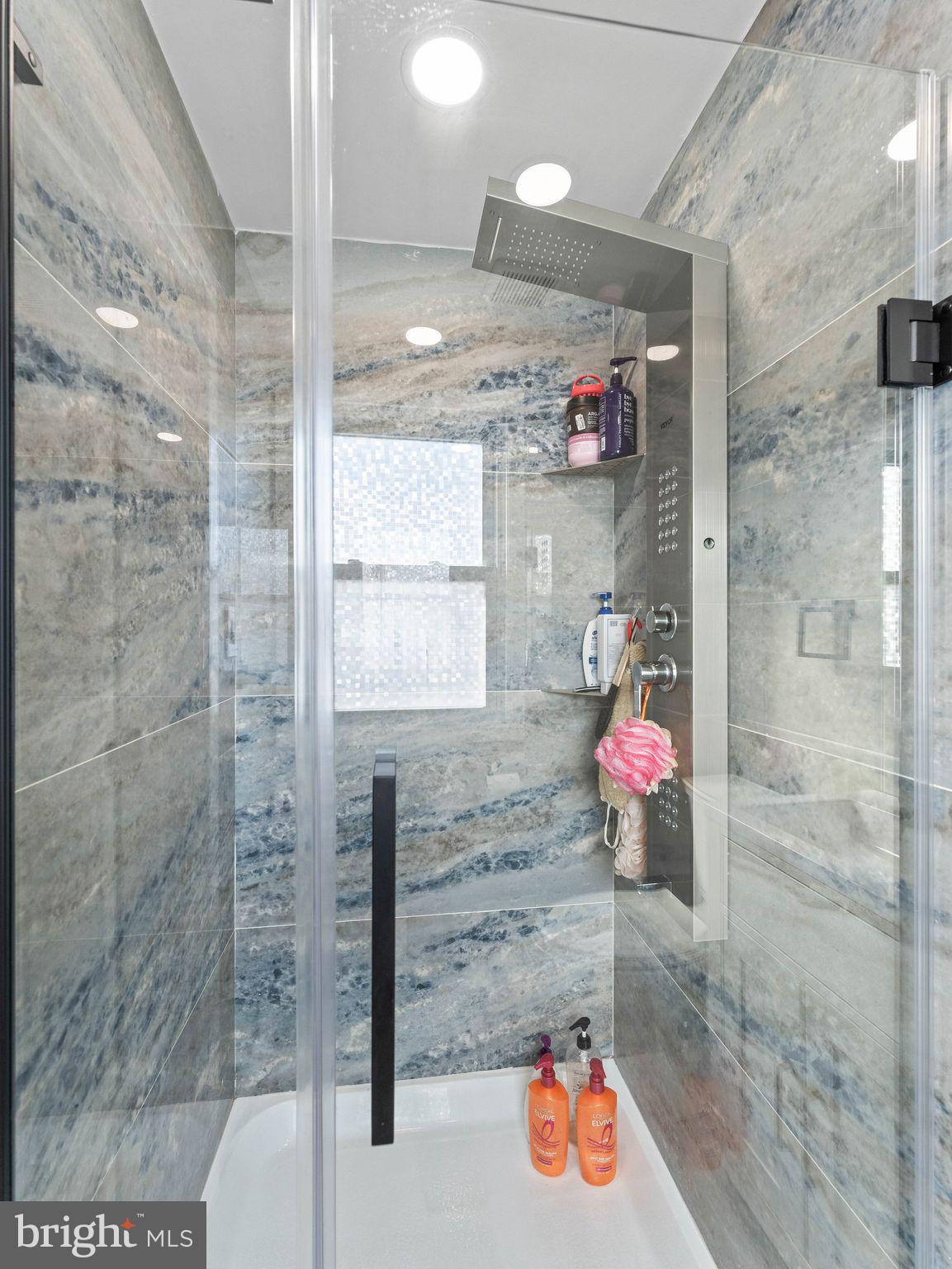 1152 Morefield Road Philadelphia, PA 19115 - Photo 12 of 29 a bathroom with a bathtub shower sink and mirror