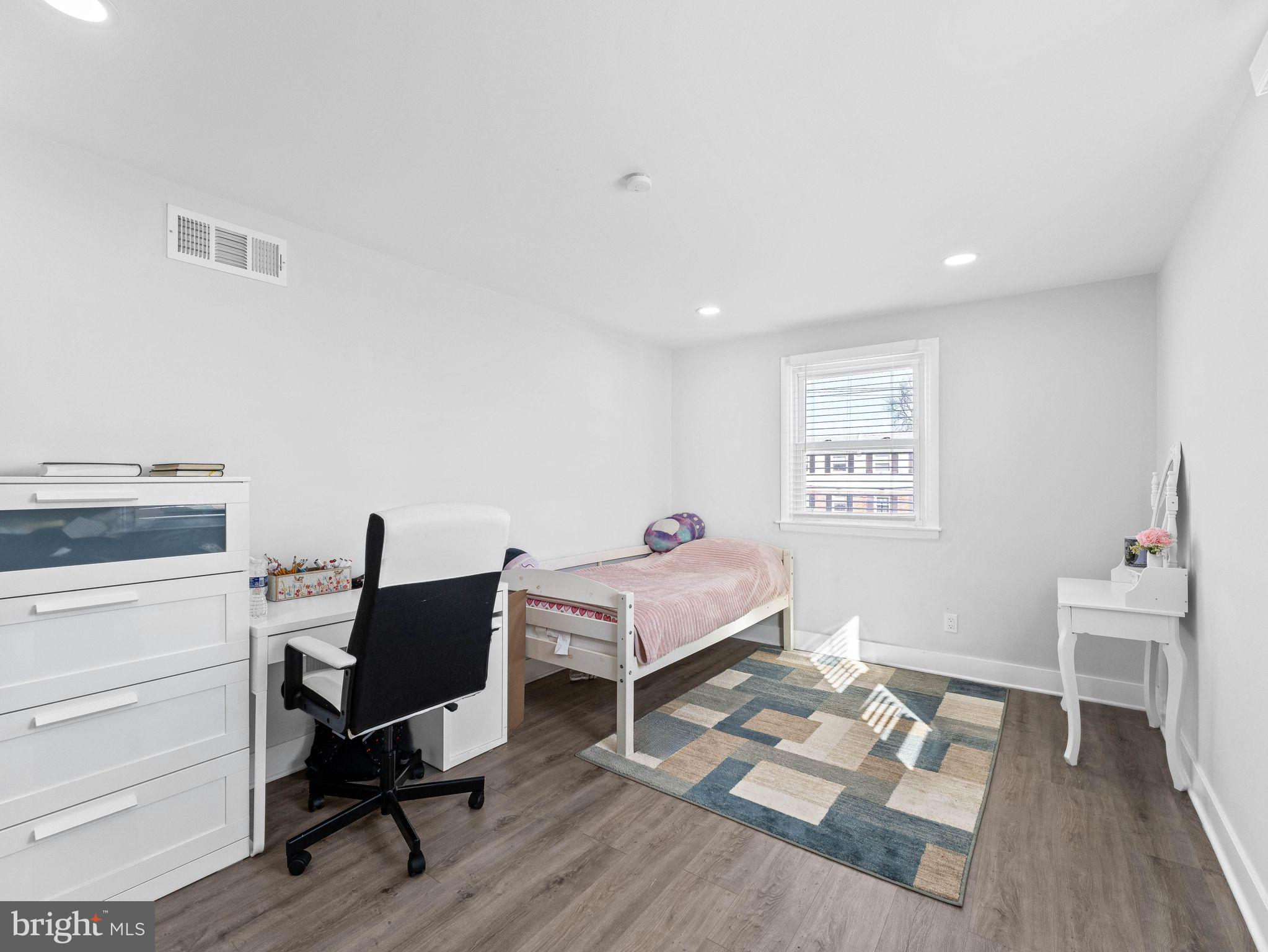 1152 Morefield Road Philadelphia, PA 19115 - Photo 14 of 29 a bedroom with a bed and a desk in it