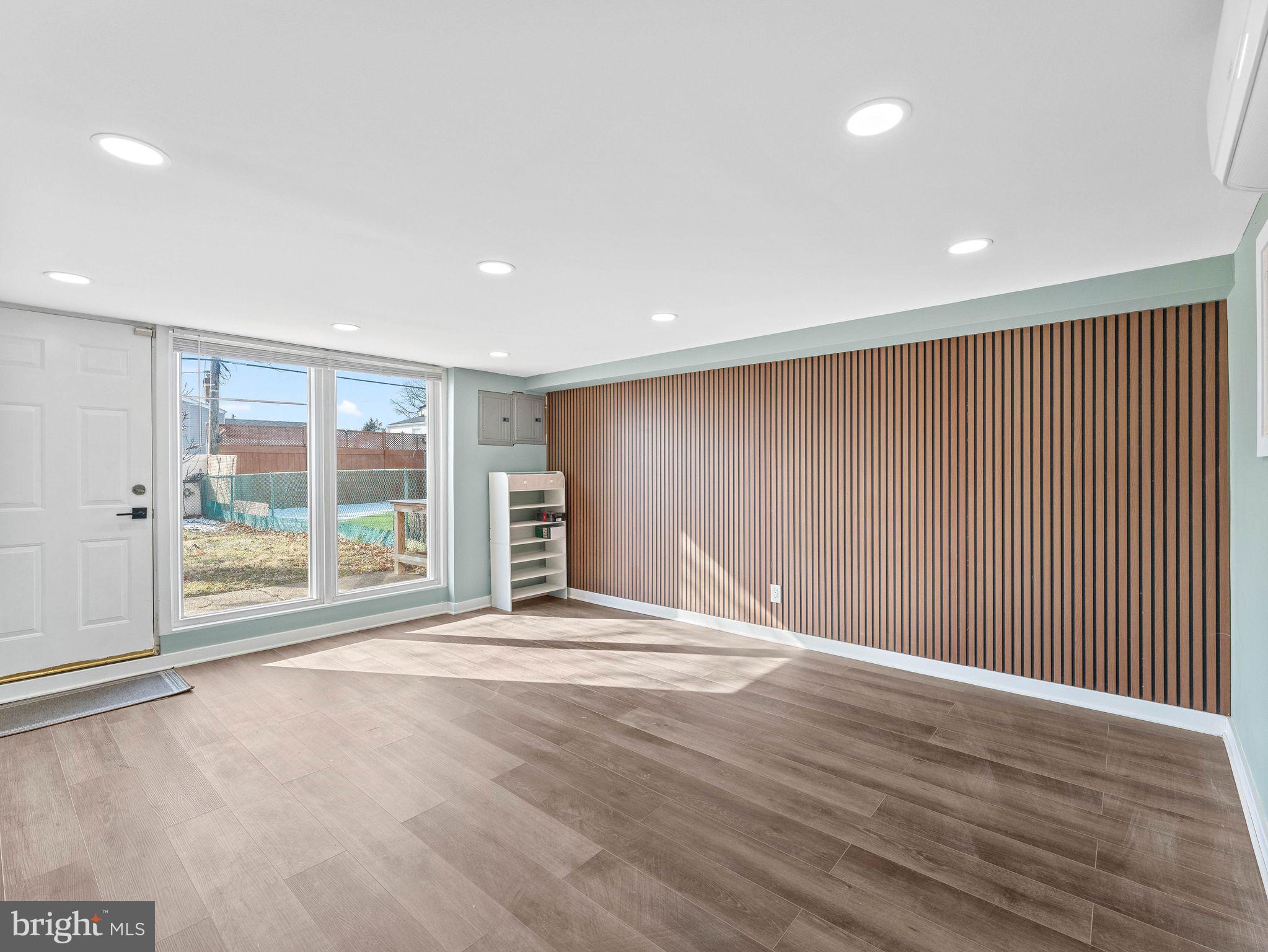 1152 Morefield Road Philadelphia, PA 19115 - Photo 20 of 29 a view of an empty room with wooden floor and a window