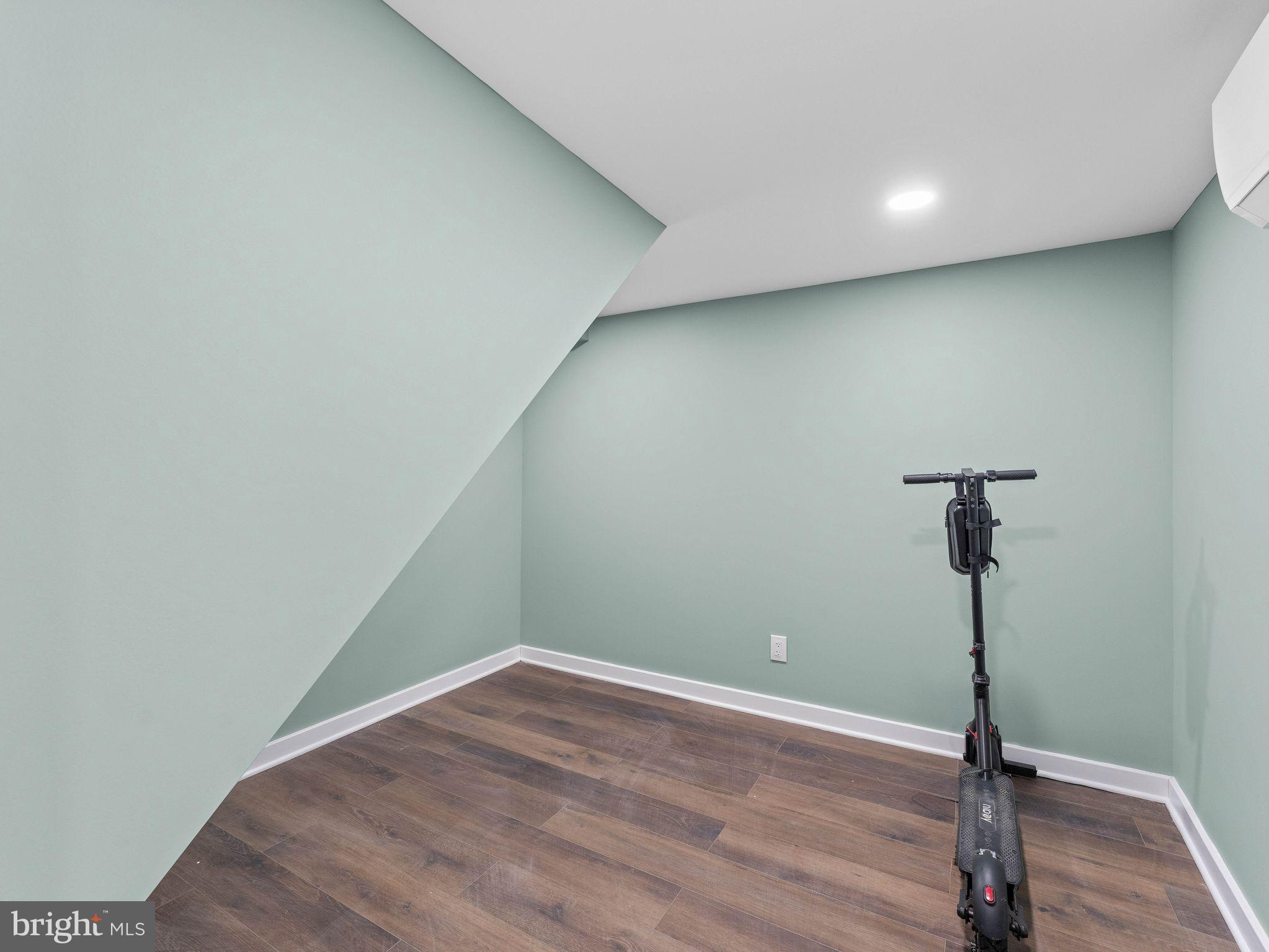 1152 Morefield Road Philadelphia, PA 19115 - Photo 23 of 29 a view of a room with wooden floor and a ceiling fan