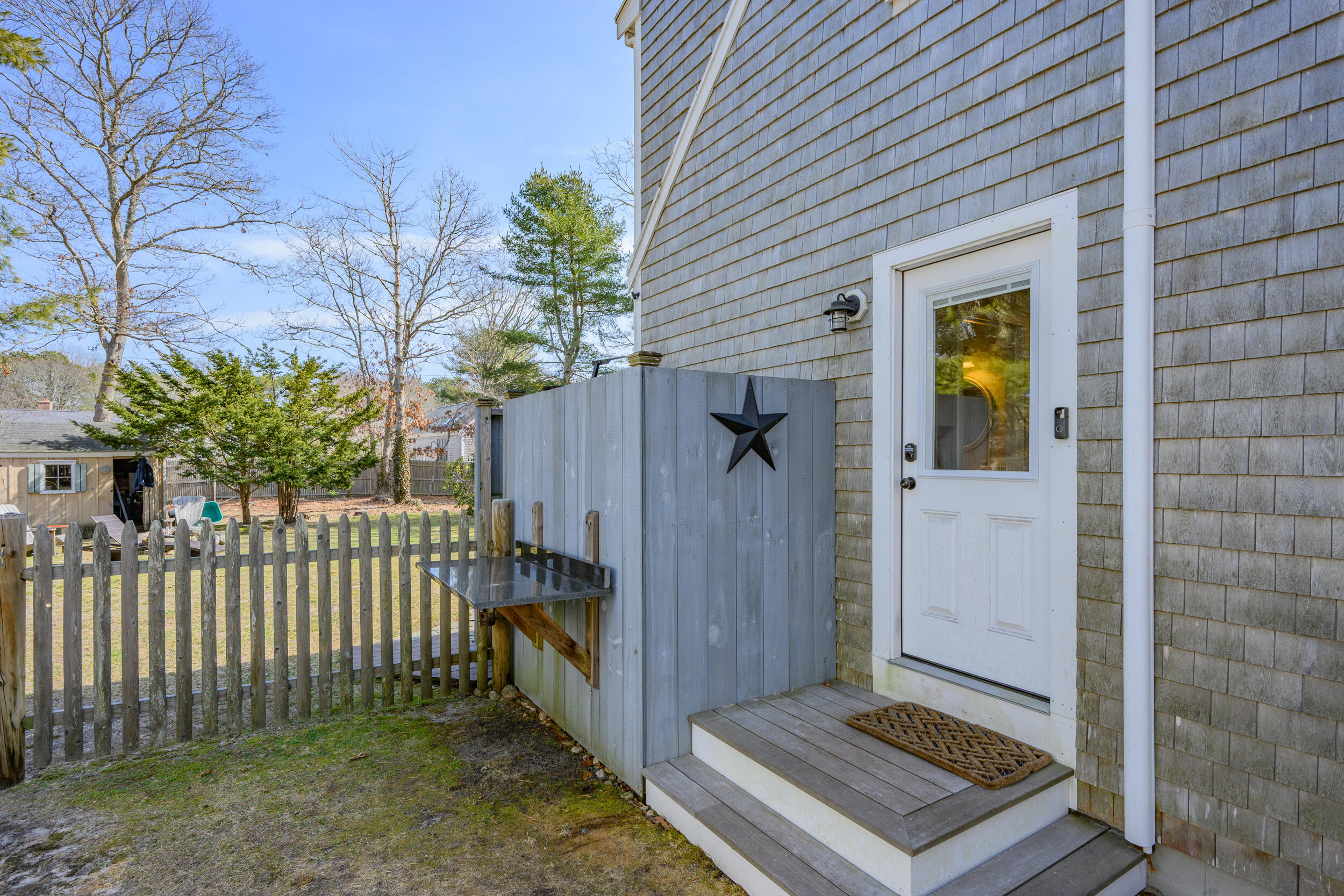 172 Skunknet Road Centerville, MA 02632 - Photo 25 of 37 Side entry with outdoor shower