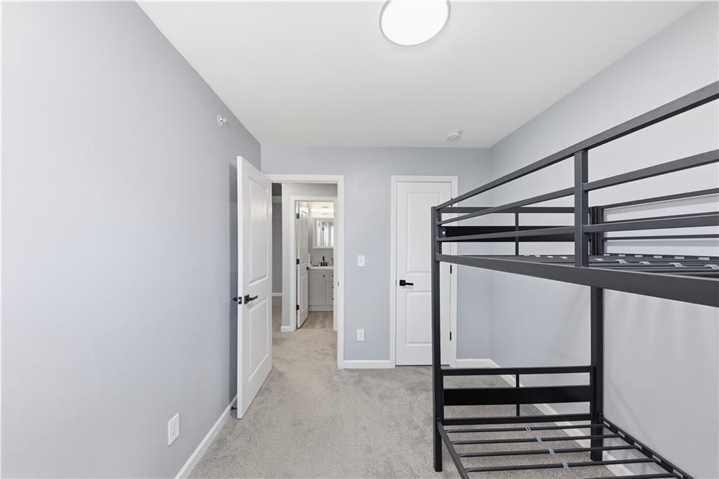 2166 Braxton Road Southwest Atlanta, GA 30331 - Photo 11 of 19 a view of a hallway with wooden floor and staircase