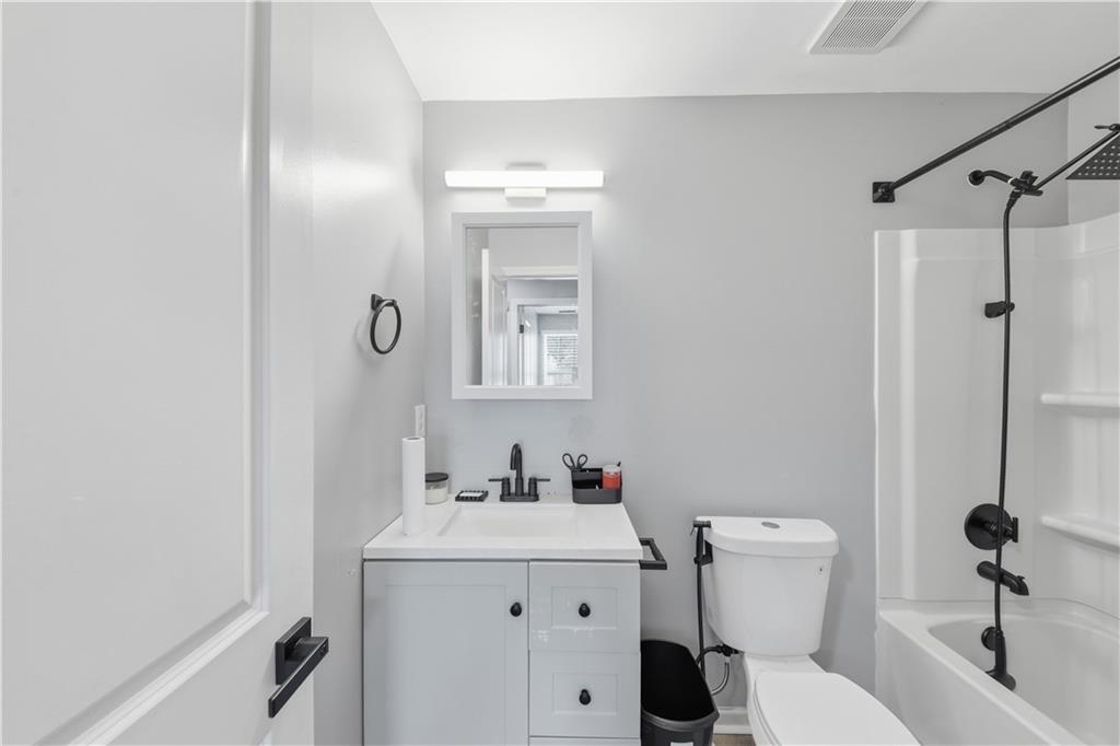 2166 Braxton Road Southwest Atlanta, GA 30331 - Photo 13 of 19 a bathroom with a sink toilet and shower
