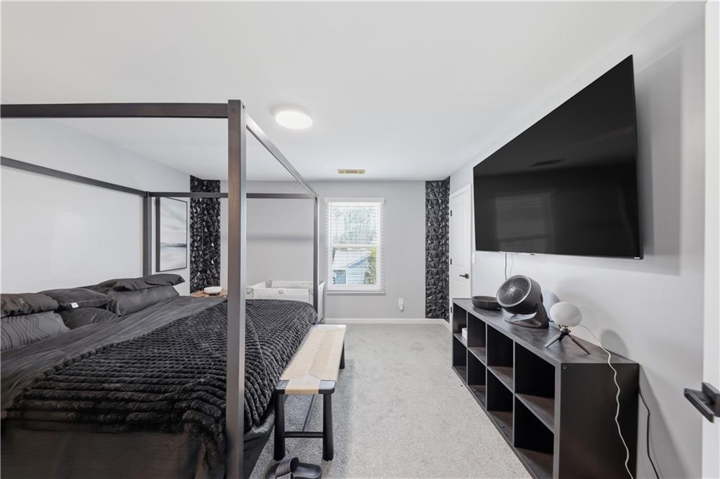 2166 Braxton Road Southwest Atlanta, GA 30331 - Photo 14 of 19 a living room with furniture and a flat screen tv