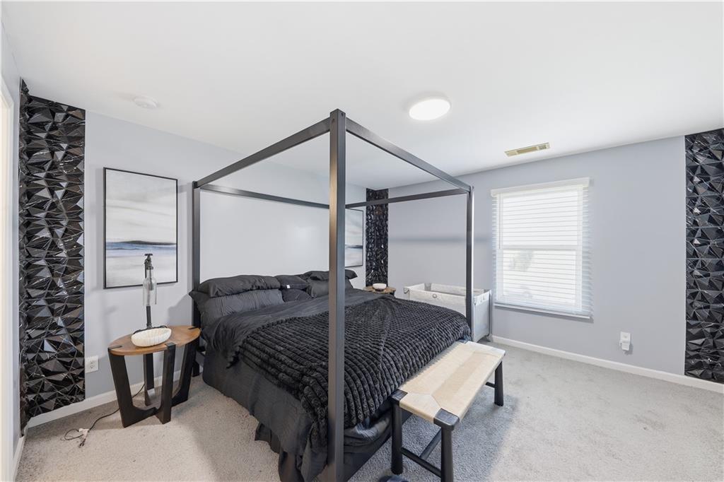 2166 Braxton Road Southwest Atlanta, GA 30331 - Photo 15 of 19 a bedroom with a bed and a window