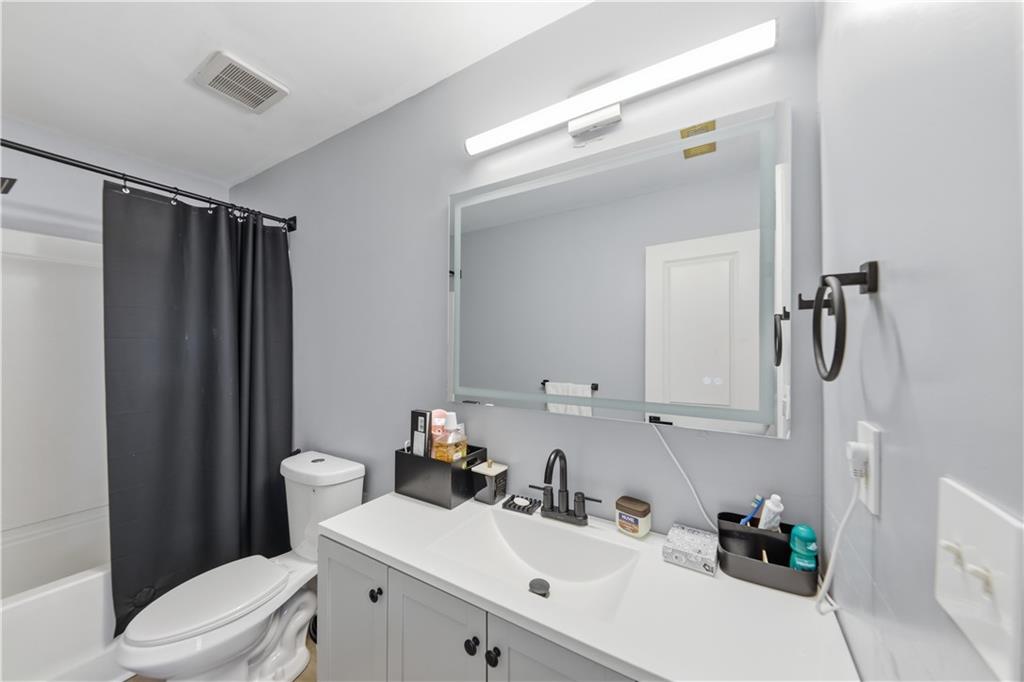 2166 Braxton Road Southwest Atlanta, GA 30331 - Photo 18 of 19 a bathroom with a sink toilet and shower