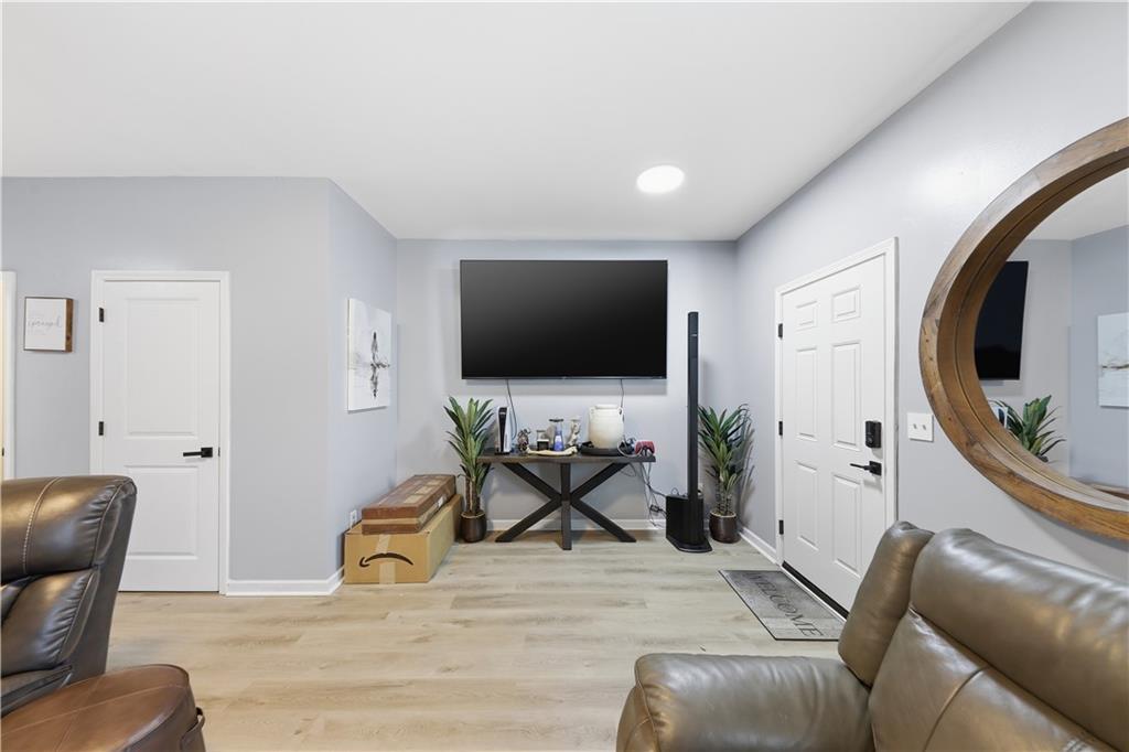 2166 Braxton Road Southwest Atlanta, GA 30331 - Photo 3 of 19 a living room with furniture and a flat screen tv
