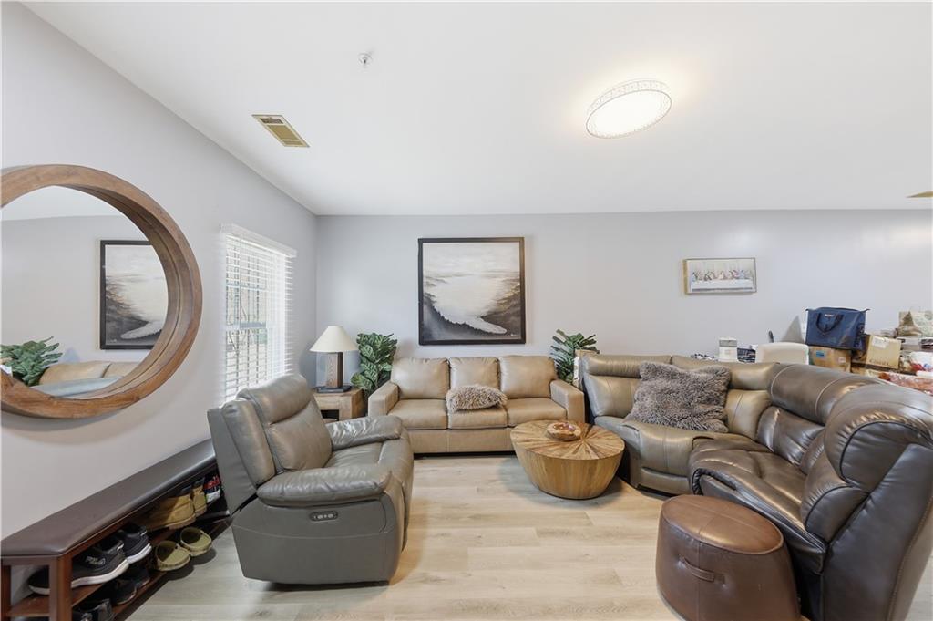 2166 Braxton Road Southwest Atlanta, GA 30331 - Photo 4 of 19 a living room with furniture and a mirror
