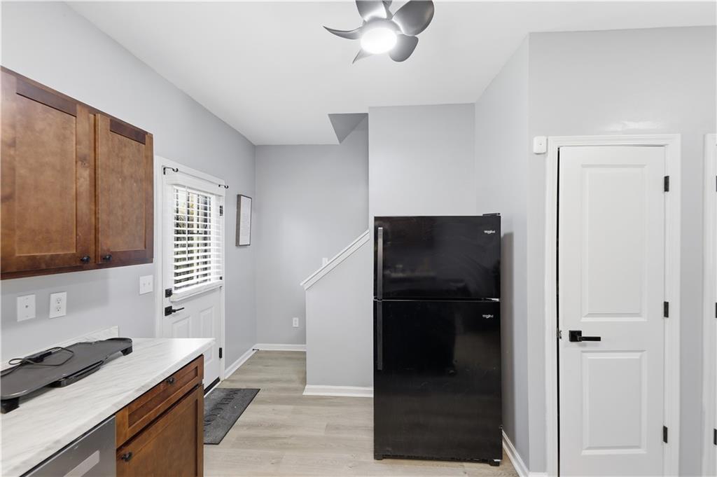 2166 Braxton Road Southwest Atlanta, GA 30331 - Photo 7 of 19 a kitchen with a refrigerator and a sink