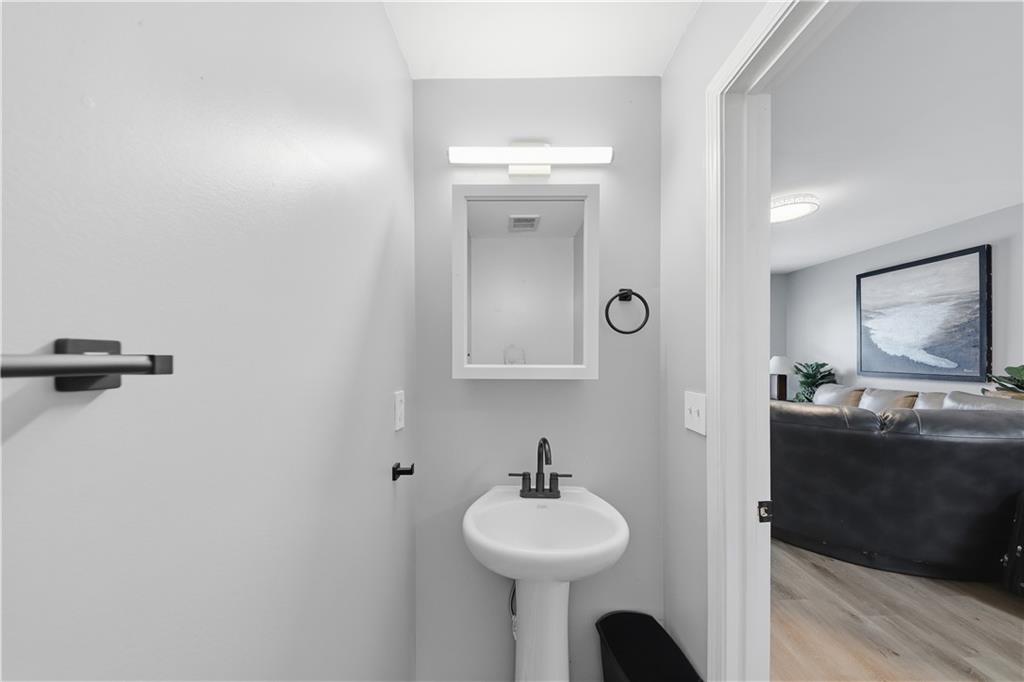 2166 Braxton Road Southwest Atlanta, GA 30331 - Photo 8 of 19 a bathroom with a sink and a mirror