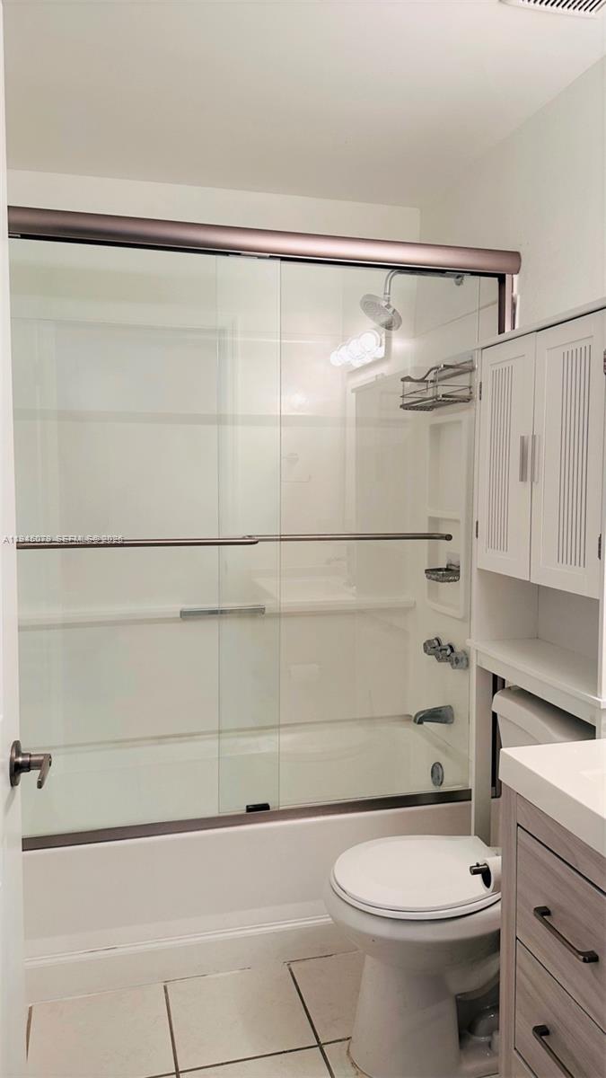 8240 Southwest 149th Court, Unit 7205 Miami, FL 33193 - Photo 13 of 14 a bathroom with a shower a toilet and a sink