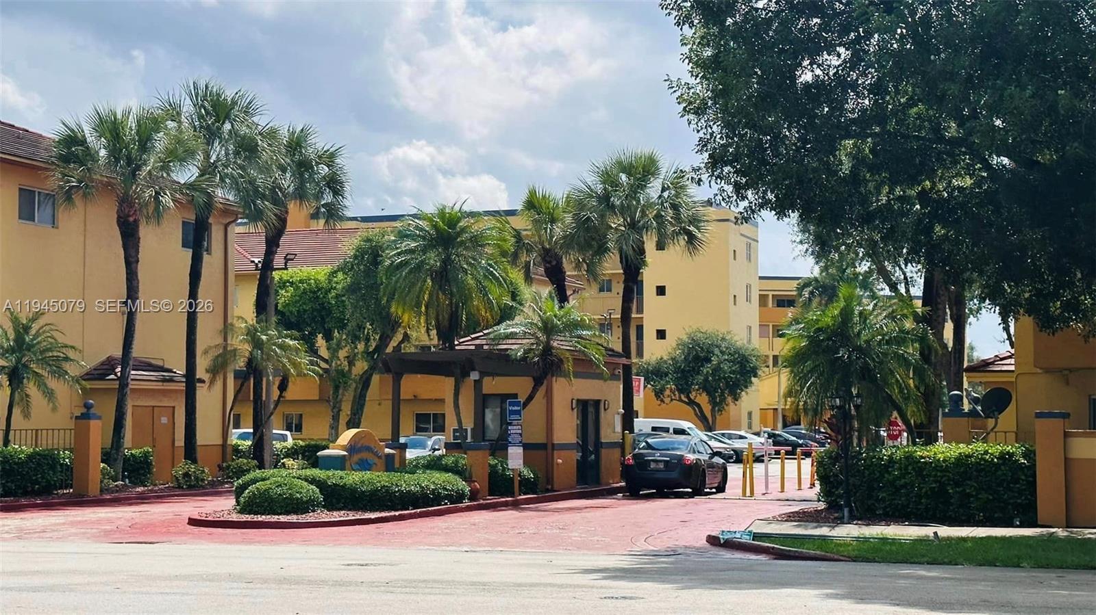 8240 Southwest 149th Court, Unit 7205 Miami, FL 33193 - Photo 2 of 14 a front view of house with yard and green space
