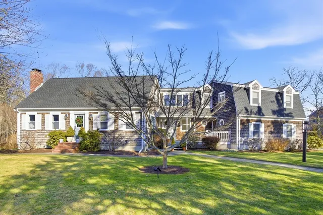 a front view of a house with a yard