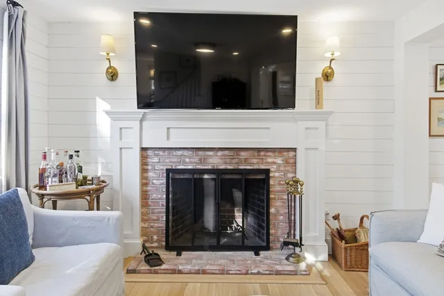 a view of a livingroom with furniture and a window