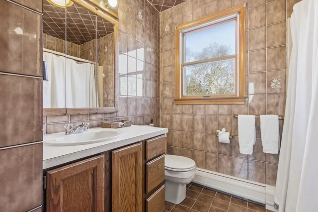 a view of storage and utility room with windows