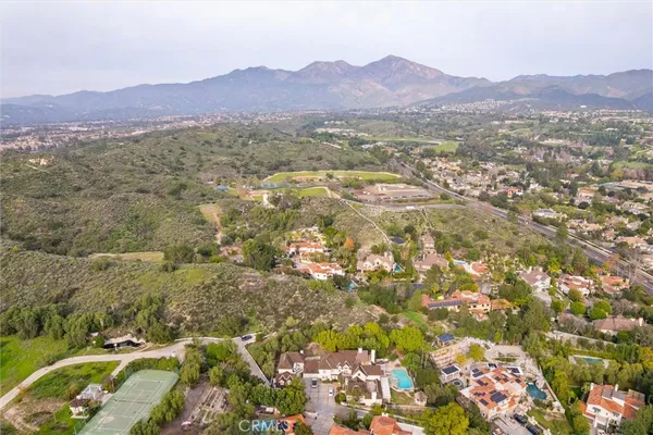 an aerial view of residential house and green space