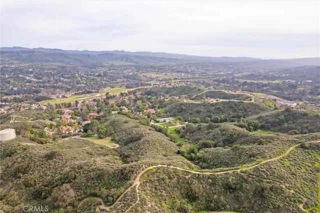 an aerial view of residential house and green space