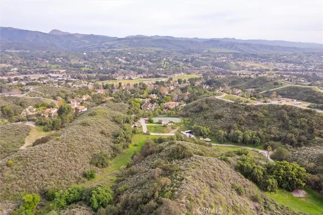 an aerial view of residential house and green space