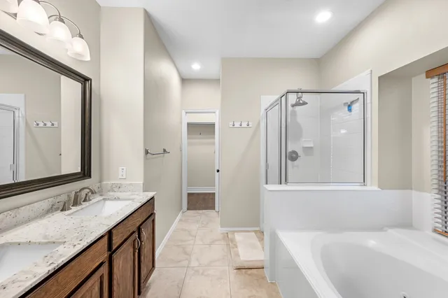 a bathroom with a bathtub and a shower