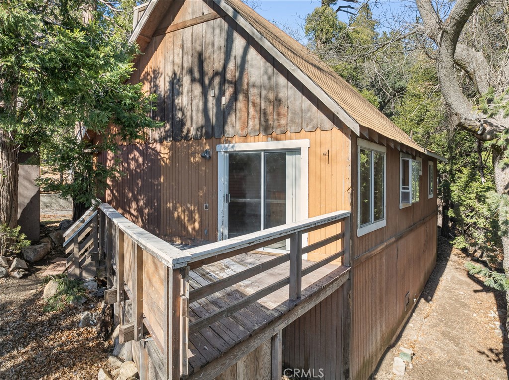 1209 Bridal Path Rimforest, CA 92378 - Photo 26 of 28 SIDE OF HOME WITH BUILDUP FOR STORAGE