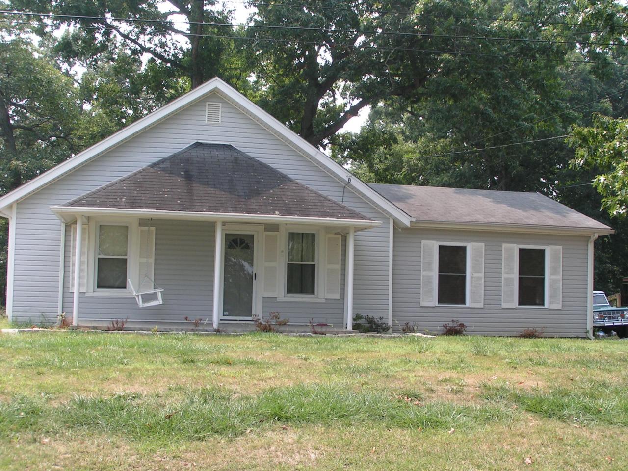 a front view of brick house with yard