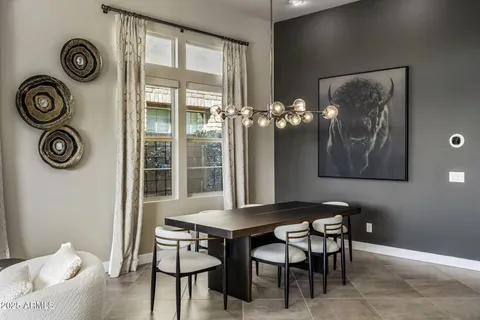 a dining room with furniture and window