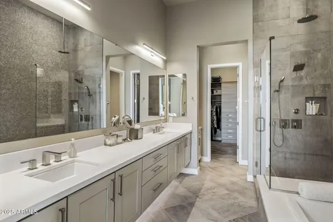 a bathroom with a double vanity sink mirror and double