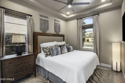 a bedroom with a large bed and a window