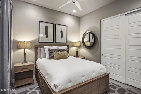 a bedroom with a bed and a closet