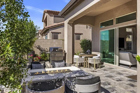 a building outdoor space with patio furniture and potted plants