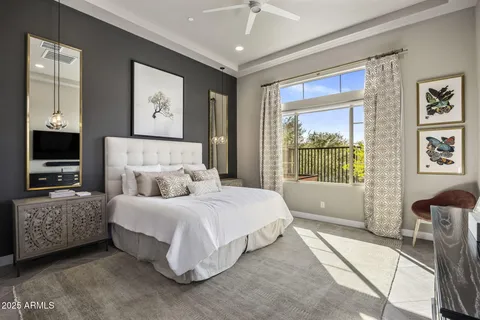 a spacious bedroom with a large bed and a window