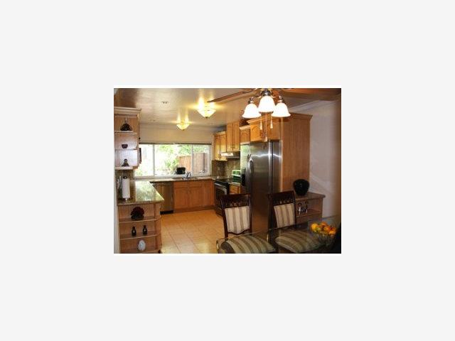 22891 Longdown Road Cupertino, CA 95014 - Photo 2 of 8 a upper view of a living room with a table and chairs