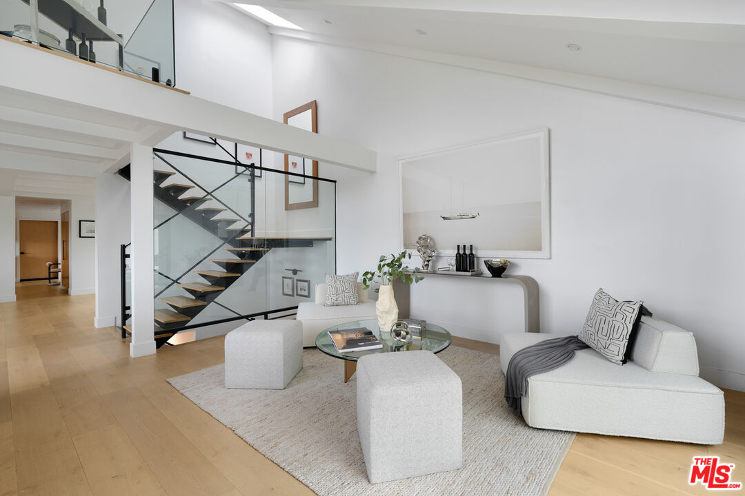 9645 Highridge Drive Beverly Hills, CA 90210 - Photo 11 of 29 a living room with furniture and white walls