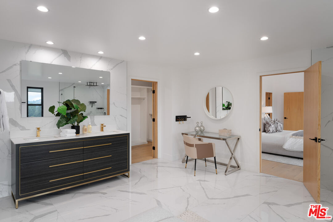 9645 Highridge Drive Beverly Hills, CA 90210 - Photo 17 of 29 a living room with furniture and a potted plant