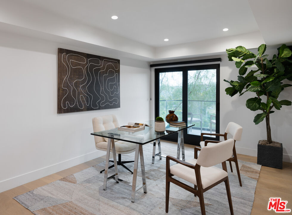 9645 Highridge Drive Beverly Hills, CA 90210 - Photo 23 of 29 a work room with furniture and a potted plant