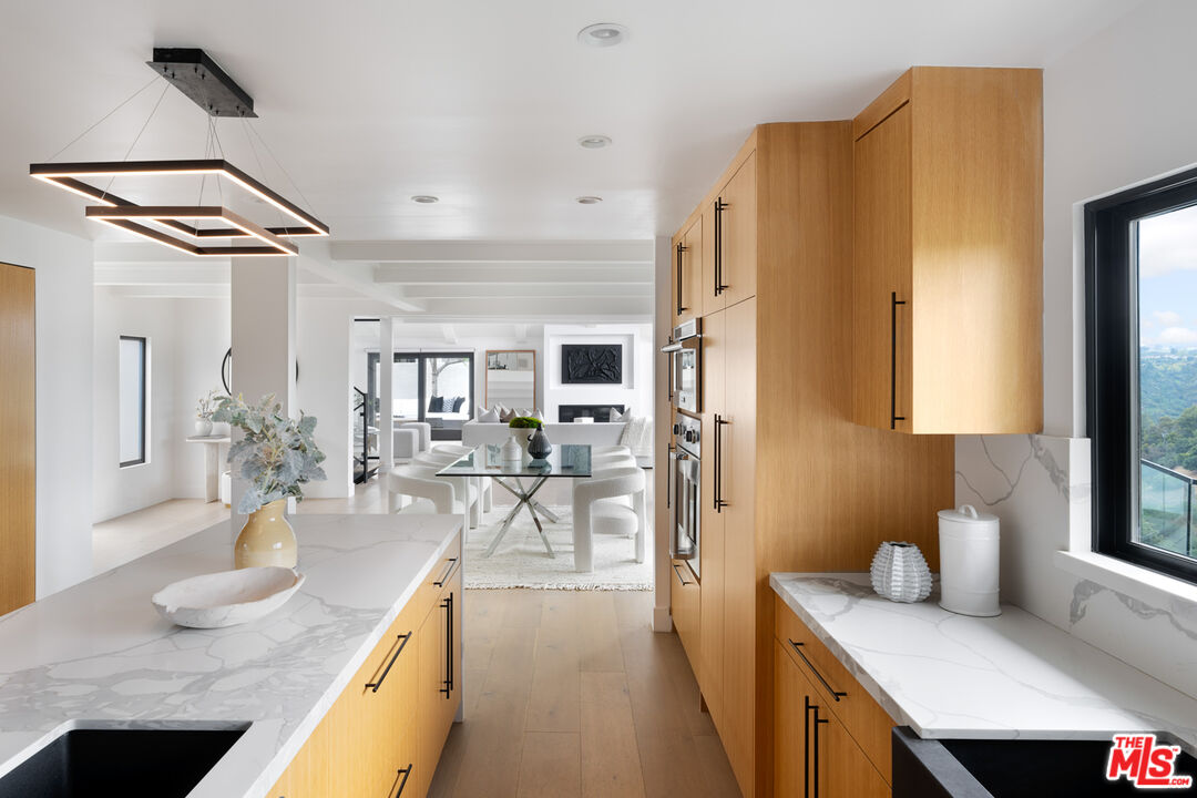 9645 Highridge Drive Beverly Hills, CA 90210 - Photo 4 of 29 a very nice looking open dining room with a large window