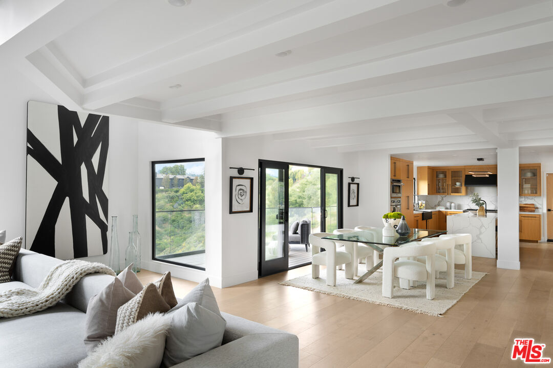 9645 Highridge Drive Beverly Hills, CA 90210 - Photo 6 of 29 a living room with furniture and a large window