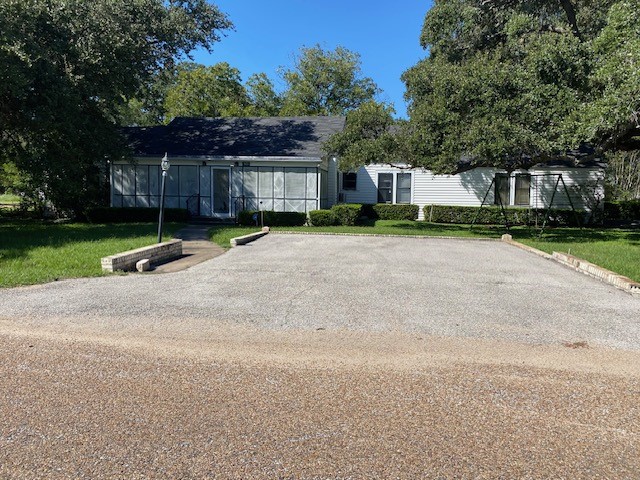 503 Main Street Garwood, TX 77442 - Photo 19 of 24 a front view of a house with a yard