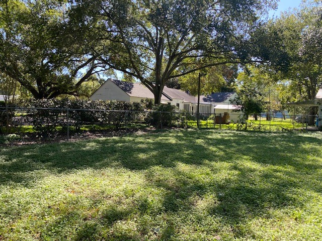 503 Main Street Garwood, TX 77442 - Photo 23 of 24 a backyard of a house with lots of green space