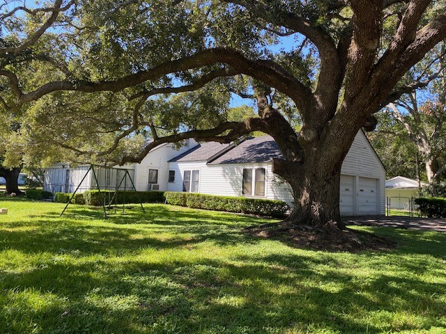 503 Main Street Garwood, TX 77442 - Photo 24 of 24 a front view of a house with a yard