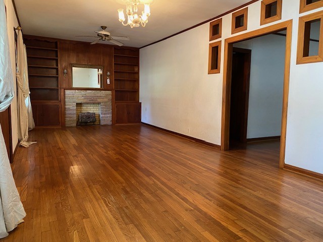 503 Main Street Garwood, TX 77442 - Photo 5 of 24 a view of a hallway with wooden floor and a kitchen