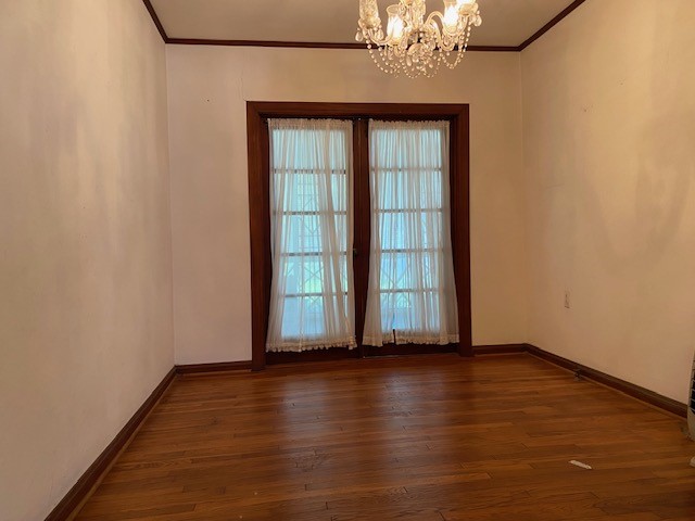 503 Main Street Garwood, TX 77442 - Photo 6 of 24 an empty room with wooden floor and windows