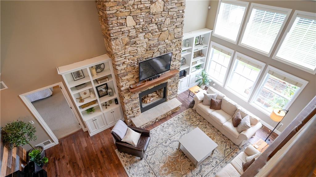 121 Stoney Springs Road Greensburg, PA 15601 - Photo 11 of 45 a living room with furniture a fireplace and a flat screen tv