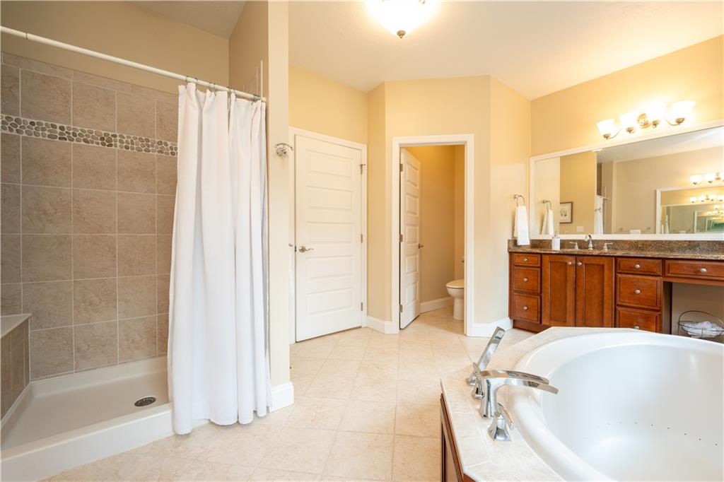 121 Stoney Springs Road Greensburg, PA 15601 - Photo 25 of 45 a bathroom with a tub a sink and a shower