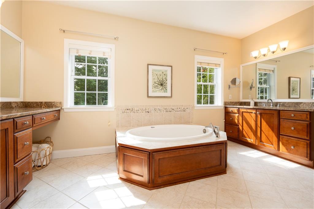 121 Stoney Springs Road Greensburg, PA 15601 - Photo 26 of 45 a spacious bathroom with a tub sink and mirror