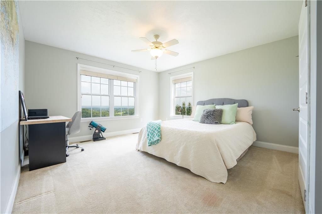 121 Stoney Springs Road Greensburg, PA 15601 - Photo 31 of 45 a bedroom with a large bed and a window