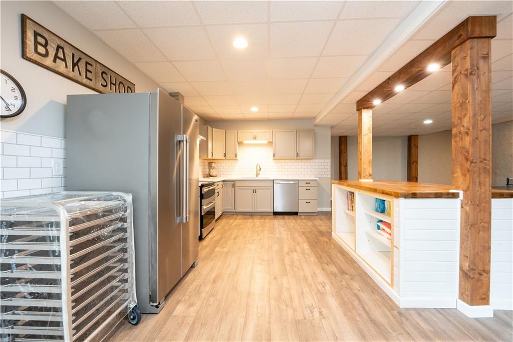 121 Stoney Springs Road Greensburg, PA 15601 - Photo 35 of 45 a view of a kitchen with wooden floor and a sink