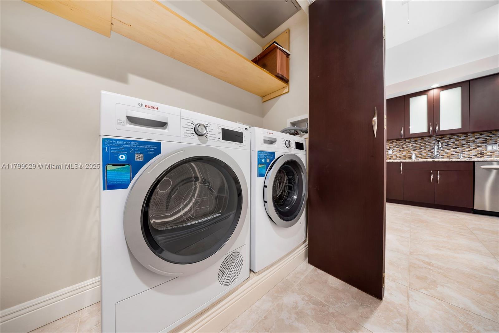 9801 Collins Avenue, Unit 5S Bal Harbour, FL 33154 - Photo 16 of 32 a utility room with dryer and washer